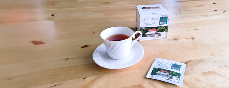 クイーンズベリー茶園パッケージと紅茶イメージ画像